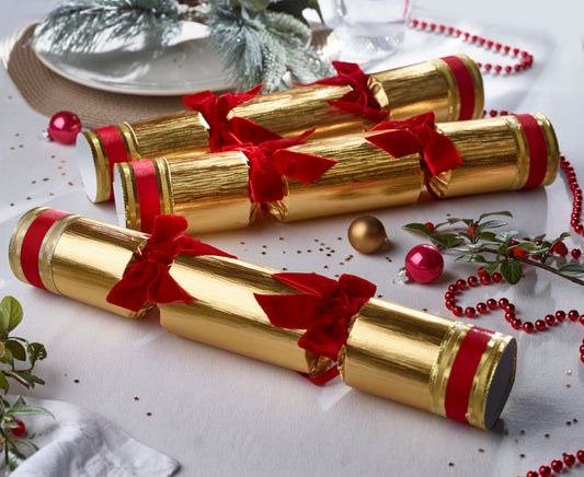 Julepynt smellbonbon i gull. Store med rød sløyfer og gaver