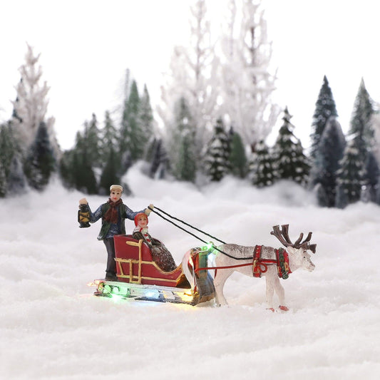 Mann og kone kjøre slede med reinsdyr - til juleby